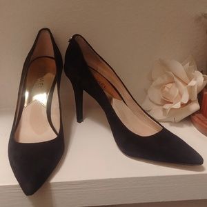 Black suede pumps